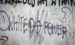 THe words "white power" are seen spray painted on a wall in the Wawer neighbourhood in War...