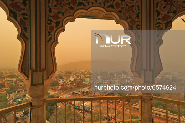 View of a city neighbourhood in Jaipur, Rajasthan, India, on March 30, 2021  is seen shrouded in haze, during a cloudy and dusty weather. 