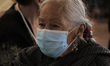 An elderly woman before being immunized by medical personnel with the AstraZeneca biologic...