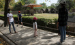 Visitors clicking their pictures in front of an enclosure of elephants at the National Zoo...