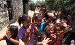 Palestinian children playing outside her family's home that suffer extreme poverty in the...