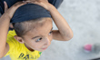 Close up of underaged, minors asylum seekers who live with their families around the burne...