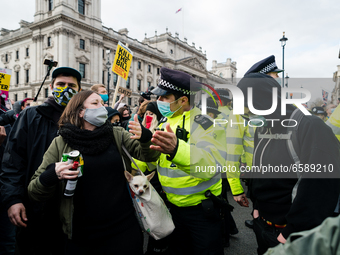Police push protester back in London, Britain, 3 April 2021. Protests around the United Kingdom have been held in opposition to the Police,...