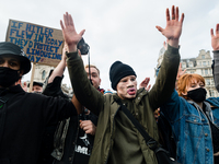 Protesters at a Kill the Bill protest raise hands in London, Britain, 3 April 2021. Protests around the United Kingdom have been held in opp...