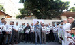 Relatives of Palestinians imprisoned in Israeli jails hold pictures of Khader Adnan, a Pal...