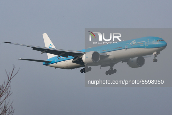 KLM Royal Dutch Airlones Boeing 777-300 aircraft as seen flying on final approach for landing at Amsterdam Schiphol AMS EHAM international a...