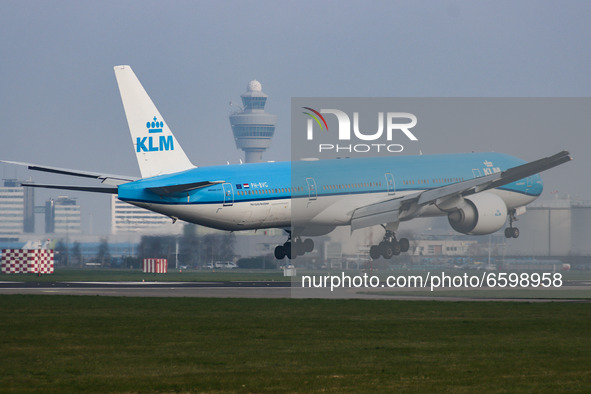 KLM Royal Dutch Airlones Boeing 777-300 aircraft as seen flying on final approach for landing at Amsterdam Schiphol AMS EHAM international a...