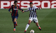 Trincao of Barcelona and Ruben Alcaraz of Valladolid compete for the ball during the La Li...