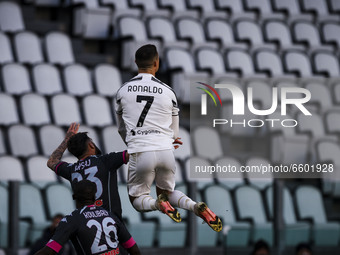 Juventus forward Cristiano Ronaldo (7) jumps for the ball during the Serie A football match n.3 JUVENTUS - NAPOLI on April 07, 2021 at the A...