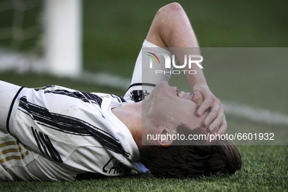 Juventus midfielder Federico Chiesa (22) lies on the ground injured during the Serie A football match n.3 JUVENTUS - NAPOLI on April 07, 202...