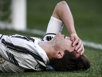 Juventus midfielder Federico Chiesa (22) lies on the ground injured during the Serie A football match n.3 JUVENTUS - NAPOLI on April 07, 202...