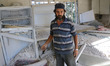 Home owner inspects the remains of his belongings that were destroyed by bombing
Targetin...
