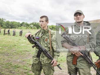 Volunteers of a battalion of the DPR army during a military training in the outskirts of Donetsk city on June 29, 2015. (