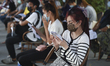 People who are related to entertainment places queue up during a nasal swab test for COVID...