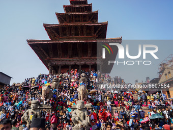 Devotees gather to observe the pulling of a chariot carrying an idol of Hindu god Bhairav during the Bisket Jatra festival held to mark the...