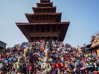 Devotees gather to observe the pulling of a chariot carrying an idol of Hindu god Bhairav during the Bisket Jatra festival held to mark the...