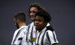 Juventus midfielder Weston McKennie (14) celebrates with Juventus midfielder Adrien Rabiot...