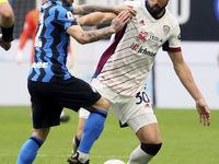 Stefano Sensi (L) of FC Internazionale competes for the ball with Leonardo Pavoletti (R) of Cagliari Calcio during the Serie A match between...