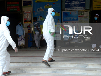 A group of health worker is seen in front of Dhaka Medical College Hospital for treatment in Dhaka, Bangladesh, on April 12, 2021.

 (