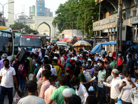 People waits at a bus stop for leave the city as Bangladesh authorities ordered an eight-day lockdown to contain the spread of the Covid-19...