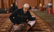 Kashmiri muslims read Holy Quran on the first day of Ramadan in Kahsmir's grand Mosque Jam...