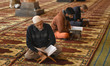 Kashmiri muslims read Holy Quran on the first day of Ramadan in Kahsmir's grand Mosque Jam...
