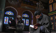 Kashmiri muslims read Holy Quran on the first day of Ramadan inside a shrine in Srinagar,...