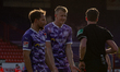 Ulrich Taffertshofer (left) and  Lukas Gugganig (middle) of VfL Osnabrueck protest against...