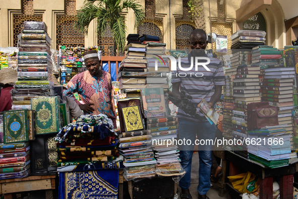 A Muslim man shop for Holly Quran on the second day of holy month of Ramadan at the Lagos Central Mosque (Lagos Island) located along the bu...