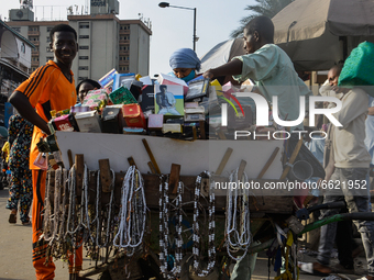 A Muslim man sells prayer beads after a prayer on the second day of holy month of Ramadan along the busy Nnamdi Azikiwe Street of Lagos, Nig...