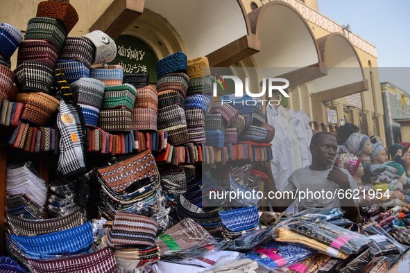 A trader of traditional Nigerian cap is waiting for customers at the entrance of the Lagos Central Mosque (Lagos Island) located along the b...
