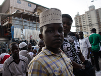 A Muslim pose for a portrait after shopping for a traditional Nigerian cap at the entrance of the Lagos Central Mosque (Lagos Island) locate...