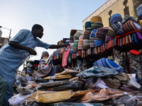 A trader of display traditional Nigerian cap for customers at the entrance of the Lagos Central Mosque (Lagos Island) located along the busy...