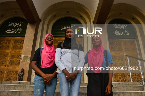 Muslim girls covered with hijabs pose for a photograph at the entrance of the Lagos Central Mosque (Lagos Island) located along the busy Nna...