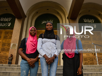 Muslim girls covered with hijabs pose for a photograph at the entrance of the Lagos Central Mosque (Lagos Island) located along the busy Nna...