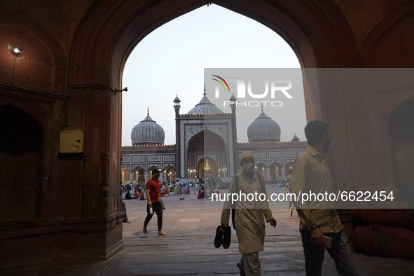 Muslims leave after offering prayers during the holy month of Ramadan, amidst the spread of the coronavirus disease (Covid-19), at Jama Masj...