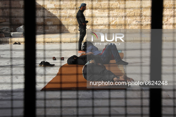 Palestinians take rest before their breakfast in Al Omari mosque during the Muslim holy month of Ramadan, in Gaza City, on April 16, 2021.
 