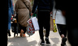 Shoppers carry bags along a busy Oxford Street in London, England, on April 17, 2021. Acro...