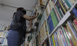 A worker at the antiquarian bookstore El Tomo Suelto, located in the Zócalo of Mexico City...