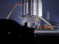 A security guard blocks the entrance to Starship SN15's launch pad on the evening on April 25th, 2021 at SpaceX's South Texas Launch Site in...