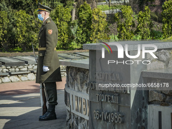 Soldier guards the memorial site about the Chernobyl catastrophe during the celebrations in Kiev, Ukraine, on April 26, 2021 of the 35th ann...
