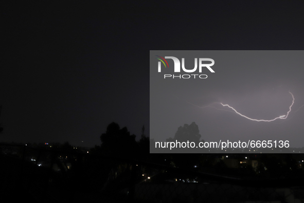 View of thunderstorm in the Lomas Estrella neighborhood, Iztapalapa, Mexico City, Mexico, on April 28, 2021 during the COVID-19 health emerg...