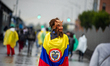 A demonstrator that wears a colombian flag with a monster mask in Bogota, Colombia on Apri...