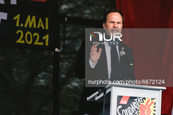 duesseldorf mayor Dr. Stephan Keller is seen speaks to in the drive in labor day rally in Duesseldorf, Germany on May 1, 2021 
