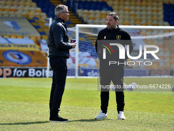  Keith Curle (Manager) of Oldham Athletic and Michael Merriman (Mansfield Head Groundsman) before the Sky Bet League 2 match between Mansfie...