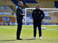 Keith Curle (Manager) of Oldham Athletic and Michael Merriman (Mansfield Head Groundsman) before the Sky Bet League 2 match between Mansfie...