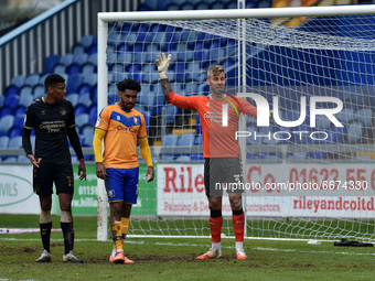 Oldham Athletic's Laurie Walker (Goalkeeper) and Oldham Athletic's Kyle Jameson with Jamie Reid of Mansfield Town during the Sky Bet League...