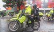 A motorcycle with a police officer and a mobile anti-riot squad in Bogota, Colombia, on Ma...