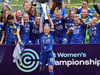  Leicester City Women celebrate as Sophie Barker of Leicester City lifts the Womens Championship trophy after the FA Women's Championship ma...
