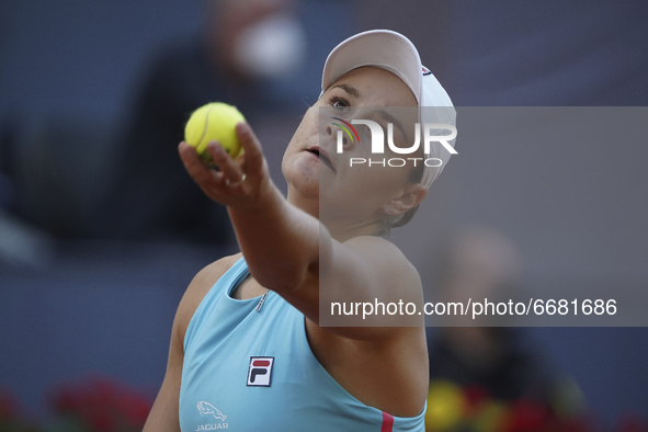 Australia's Ashleigh Barty in acion against Poland's Iga Swiatek during their 2021 WTA Tour Madrid Open tennis tournament singles match at t...